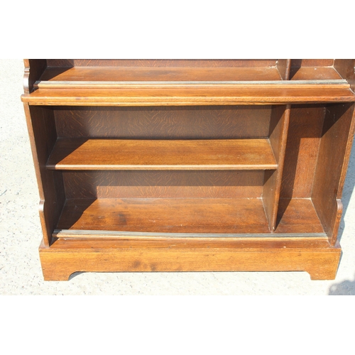 124 - A vintage oak waterfall bookcase or display shelf, approx 122cm wide x 36cm deep x 122cm tall