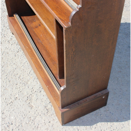 124 - A vintage oak waterfall bookcase or display shelf, approx 122cm wide x 36cm deep x 122cm tall