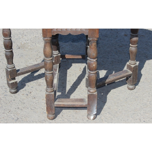 125 - A small antique oak drop leaf table with carved details, approx 77cm wide x 35cm deep (105cm fully e... 