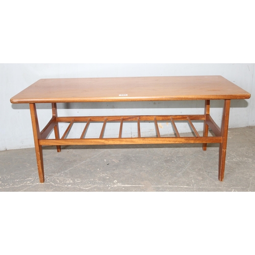 131 - Retro wooden coffee table with magazine shelf, approx 107cm W x 50cm D x 46H