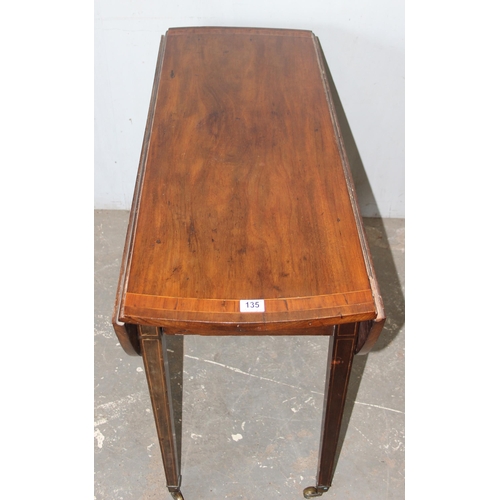 135 - An antique mahogany drop leaf table, 19th century, approx 110cm wide x 40cm deep (124cm fully extend... 