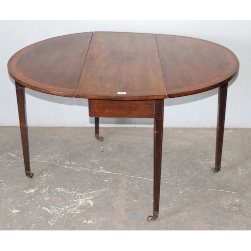 135 - An antique mahogany drop leaf table, 19th century, approx 110cm wide x 40cm deep (124cm fully extend... 