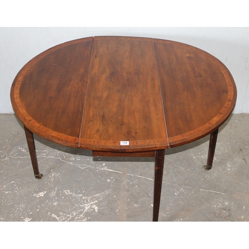 135 - An antique mahogany drop leaf table, 19th century, approx 110cm wide x 40cm deep (124cm fully extend... 