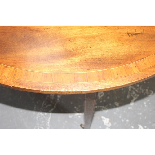 135 - An antique mahogany drop leaf table, 19th century, approx 110cm wide x 40cm deep (124cm fully extend... 