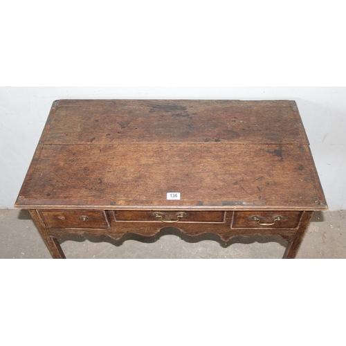 136 - A Georgian oak console table or lowboy with 3 drawers, approx 92cm wide x 49cm deep x 73cm tall