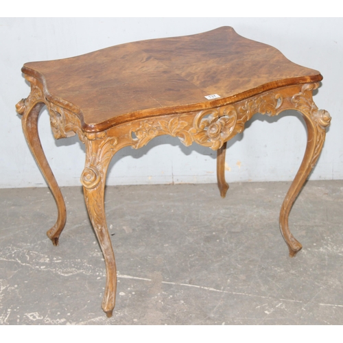 137 - An antique French-style hall table with carved details and quarter veneered top, likely c.1900, appr... 