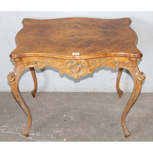 137 - An antique French-style hall table with carved details and quarter veneered top, likely c.1900, appr... 