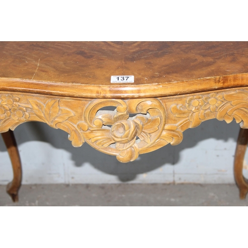 137 - An antique French-style hall table with carved details and quarter veneered top, likely c.1900, appr... 