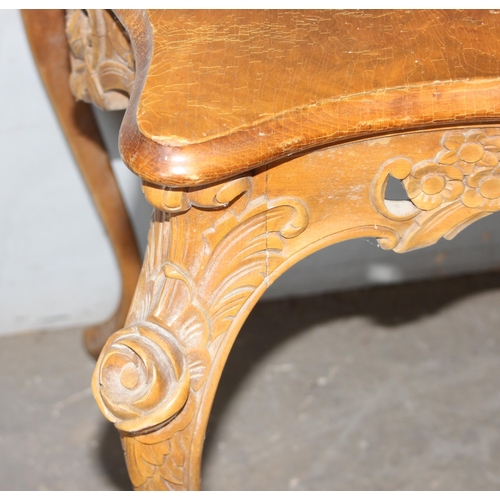 137 - An antique French-style hall table with carved details and quarter veneered top, likely c.1900, appr... 