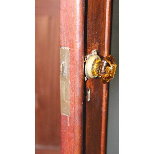 138 - An antique mahogany wardrobe by W. Obitts, with mirrored door and of unusual slim form, approx 76cm ... 