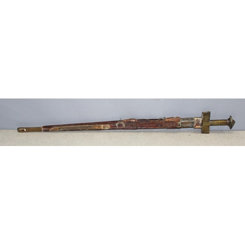 1408 - Antique sword, possibly a North/West African Tuareg Takouba with original scabbard, brass handle wit... 