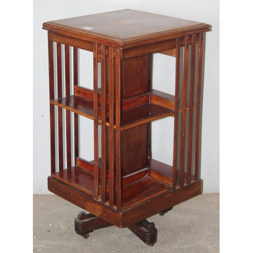 141 - An Edwardian Sheraton Revival mahogany revolving bookcase, approx 46cm wide x 46cm deep x 87cm tall