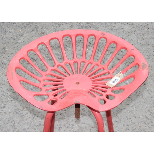 156 - Red painted tractor seat stool, approx 72cm tall