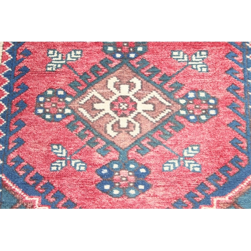 203 - Vintage hall runner rug of red ground, possibly Kurdish, approx 335cm x 80cm