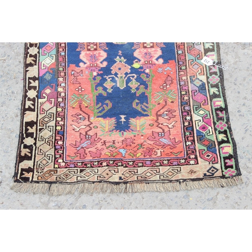 212 - A vintage Baluch style prayer rug of red and blue ground, approx 150cm x 85cm