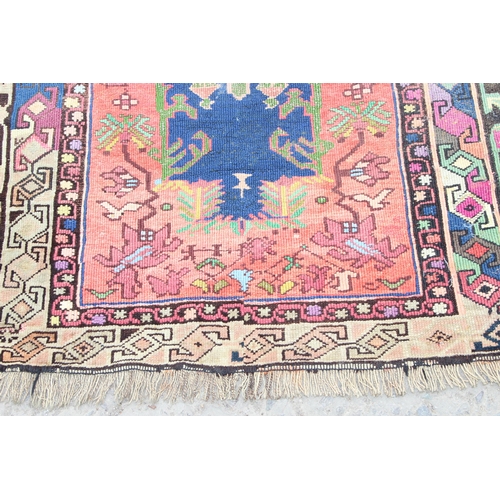 212 - A vintage Baluch style prayer rug of red and blue ground, approx 150cm x 85cm