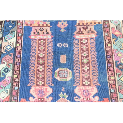 212 - A vintage Baluch style prayer rug of red and blue ground, approx 150cm x 85cm