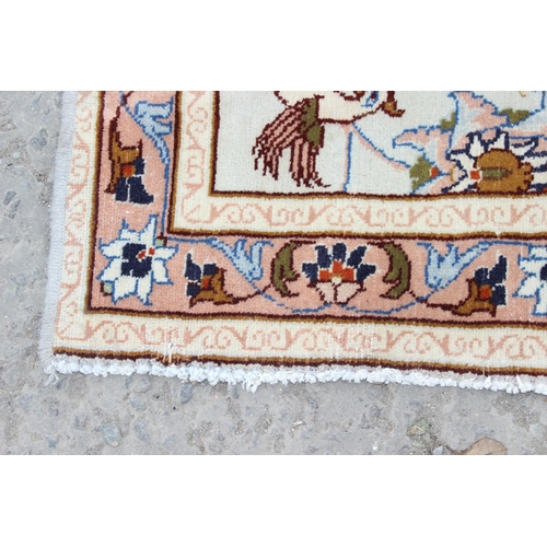 213 - A decorative cream ground runner rug with Arabesque border, approx 295cm x 85cm