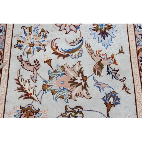 213 - A decorative cream ground runner rug with Arabesque border, approx 295cm x 85cm