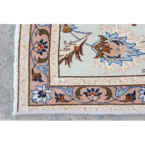 213 - A decorative cream ground runner rug with Arabesque border, approx 295cm x 85cm