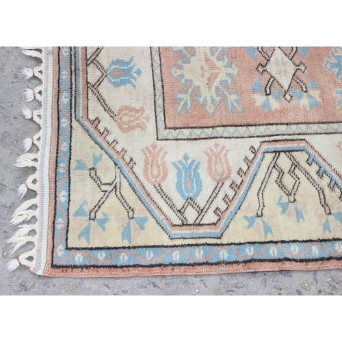 215 - A vintage orange and yellow ground rug, approx 130cm x 85cm