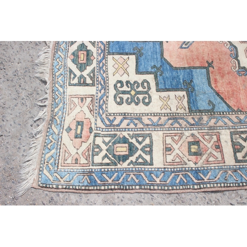 220 - A large vintage Anatolian style orange and blue ground geometric rug, approx 280cm x 162cm