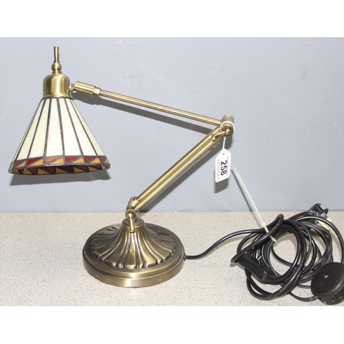 258 - An adjustable brass desk lamp with Tiffany style shade, approx 50cm when extended