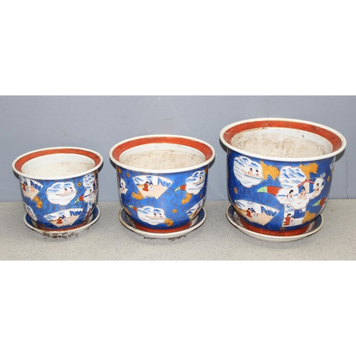 306 - Set of 3 graduated Oriental style garden plant pots with plate stands, largest approx 31 x 31 x 24cm