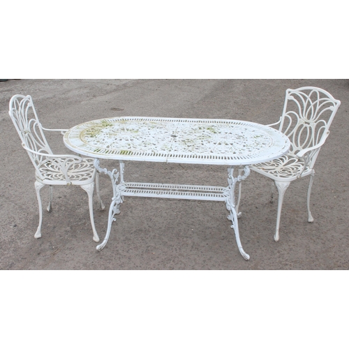 309 - Antique style white painted aluminium garden table with 2 chairs, table approx 142cm W x 81cm D x 72... 