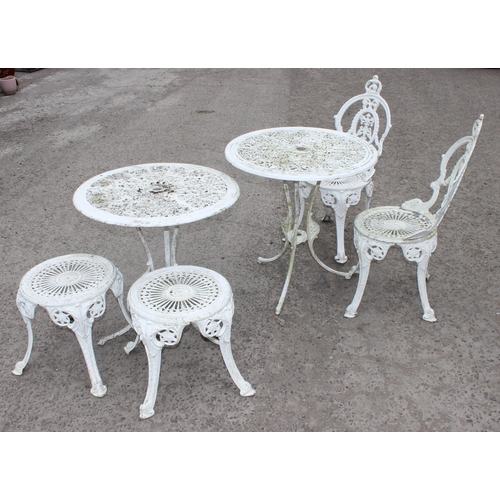 310 - 2 round antique style white painted garden tables, 2 chairs and 2 stools of similar design, largest ... 