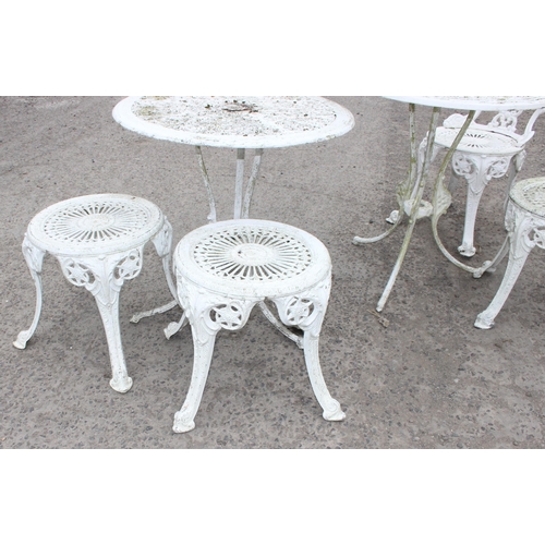 310 - 2 round antique style white painted garden tables, 2 chairs and 2 stools of similar design, largest ... 