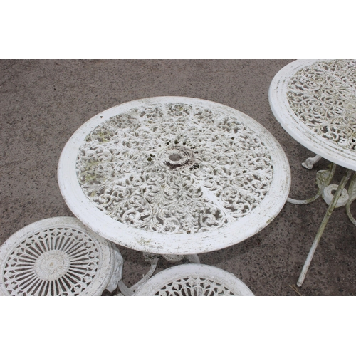 310 - 2 round antique style white painted garden tables, 2 chairs and 2 stools of similar design, largest ... 