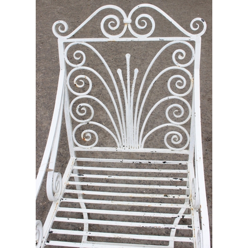 311 - A Victorian style large cast iron garden chair with scroll design, approx 110cm tall