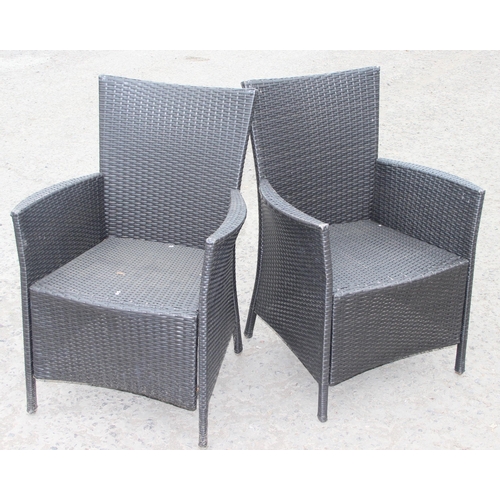 315 - Pair of rattan garden chairs with cushions