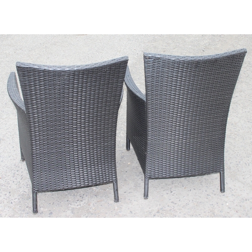 315 - Pair of rattan garden chairs with cushions