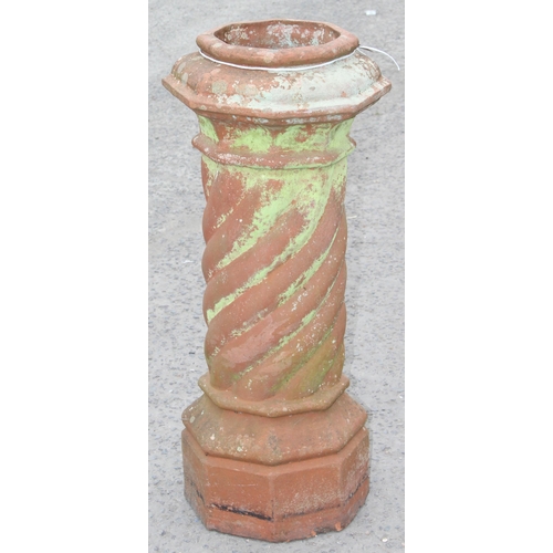 317 - Large antique terracotta chimney pot of twist decoration, approx 101cm tall