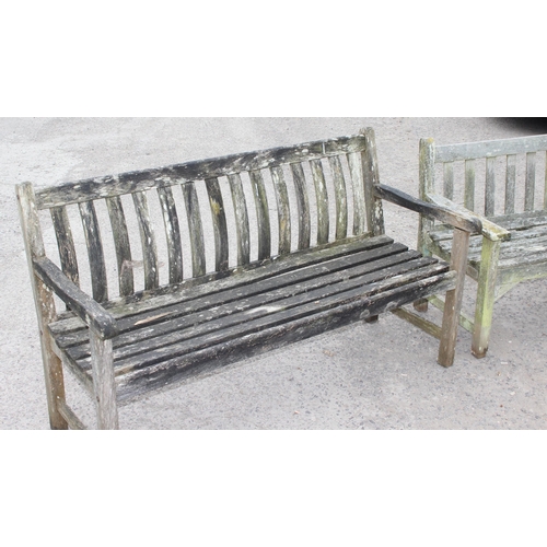 325 - 2 weathered teak weathered garden benches and a folding teak table, largest approx 150cm W x 85cm H ... 