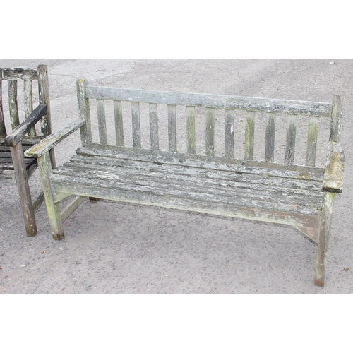 325 - 2 weathered teak weathered garden benches and a folding teak table, largest approx 150cm W x 85cm H ... 