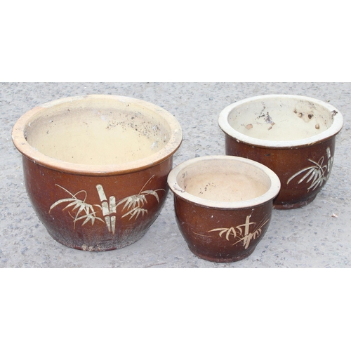 335 - 3 graduated brown glazed pots with bamboo decoration, largest approx 48cm W x 31cm H