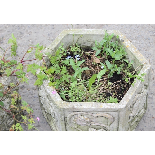 340 - Pair of hexagonal concrete garden planters with floral design, approx 41cm W x 32cm H