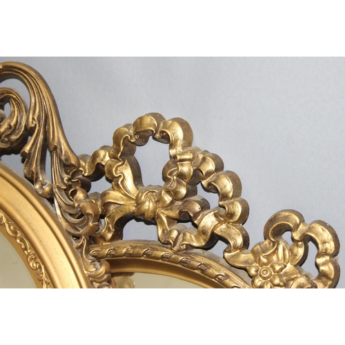 473 - 3 gilt framed oval mirrors with rococo or neo classical designs, largest approx 79cm x 41cm