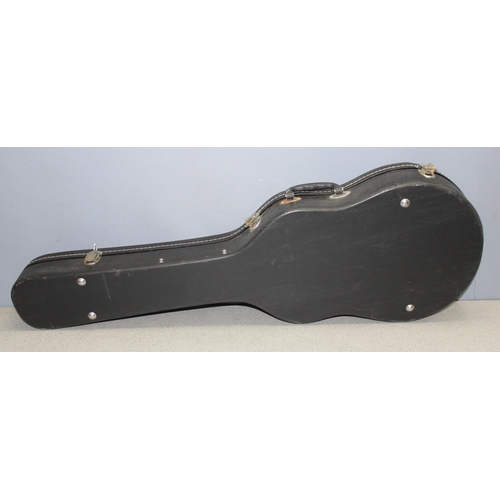 609 - Black hard-shell guitar case, approx 104cm