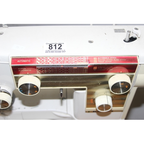 812 - New Home automatic sewing machine mounted on cabinet, with some contents, approx 61cm wide x 47cm de... 