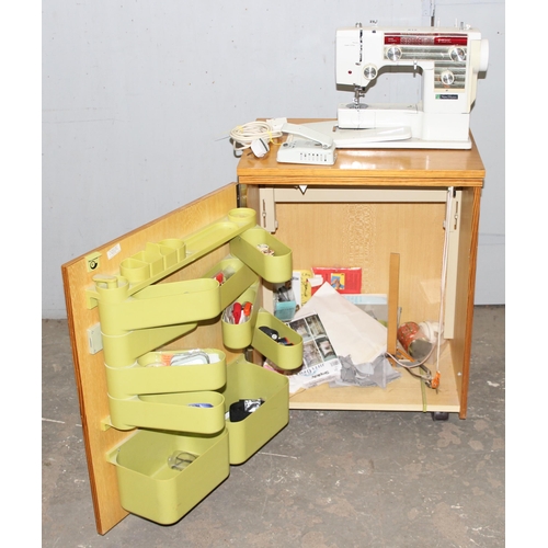 812 - New Home automatic sewing machine mounted on cabinet, with some contents, approx 61cm wide x 47cm de... 