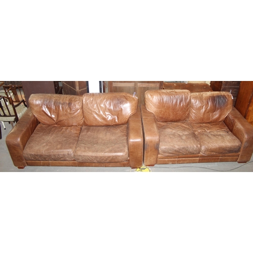 144 - Two modern brown leather sofas, largest measures 200cm x 100cm x 80cm