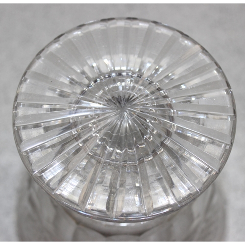 1050 - A vintage cut glass jar with silver cover, marked for London 1930 by Mappin & Webb, approx 14cm tall... 