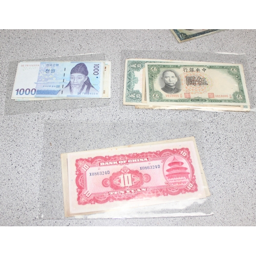 1253 - Qty of assorted vintage and later world banknotes, mainly Asian countries