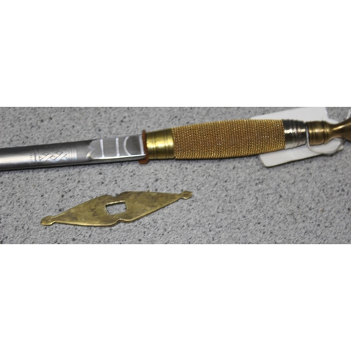 1424 - A tapering walking cane with hollow centre housing a deconstructed Masonic Sword with engraved decor... 