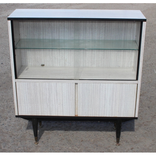 177 - A retro Formica bookcase or display cabinet by Berry Furniture, approx 94cm wide x 29cm deep x 100cm... 