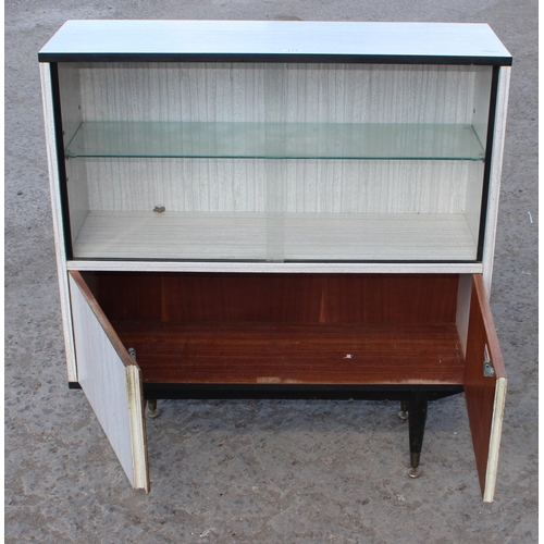 177 - A retro Formica bookcase or display cabinet by Berry Furniture, approx 94cm wide x 29cm deep x 100cm... 